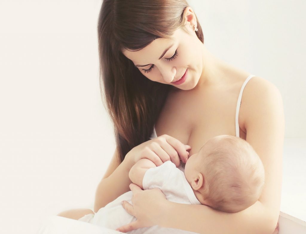Mother breastfeeding her newborn child