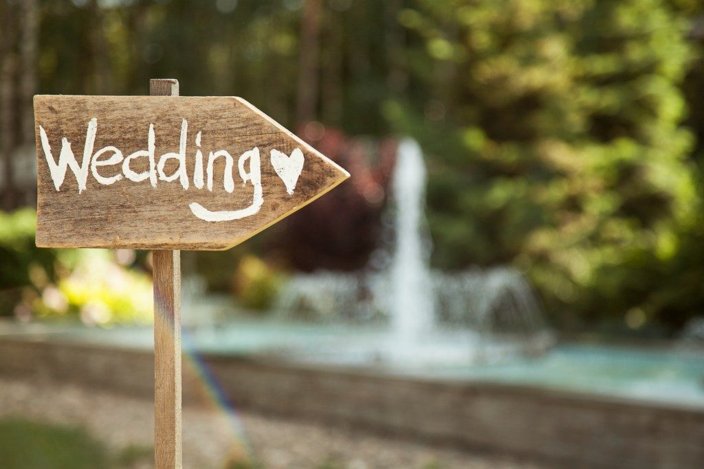 wooden plaque with wedding signage