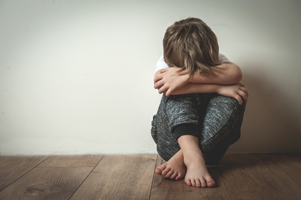 Stressed child on the floor