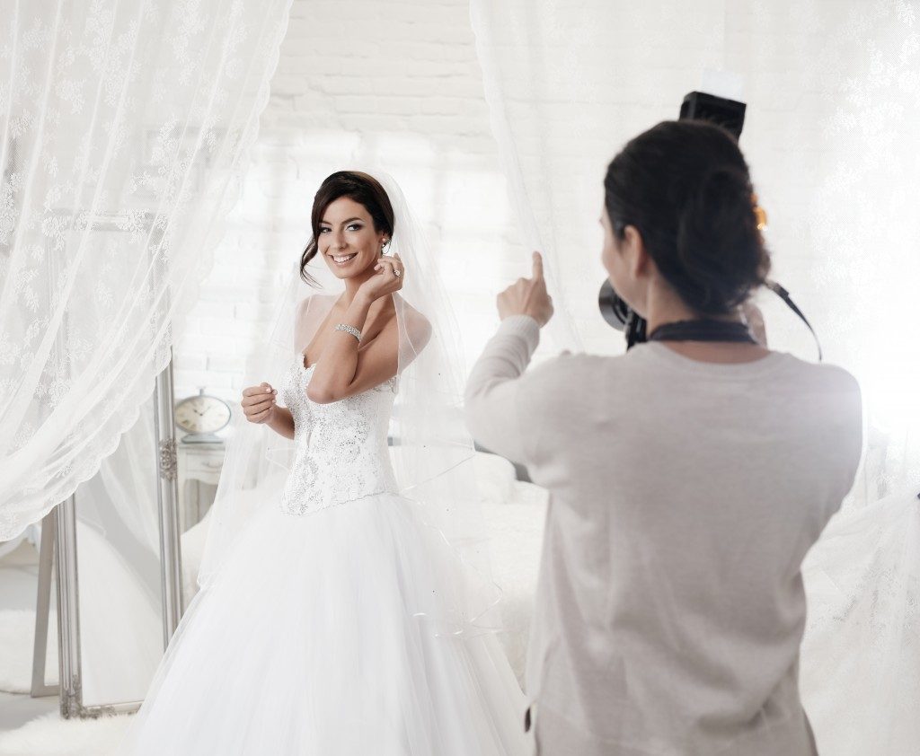 photographer shooting a bride