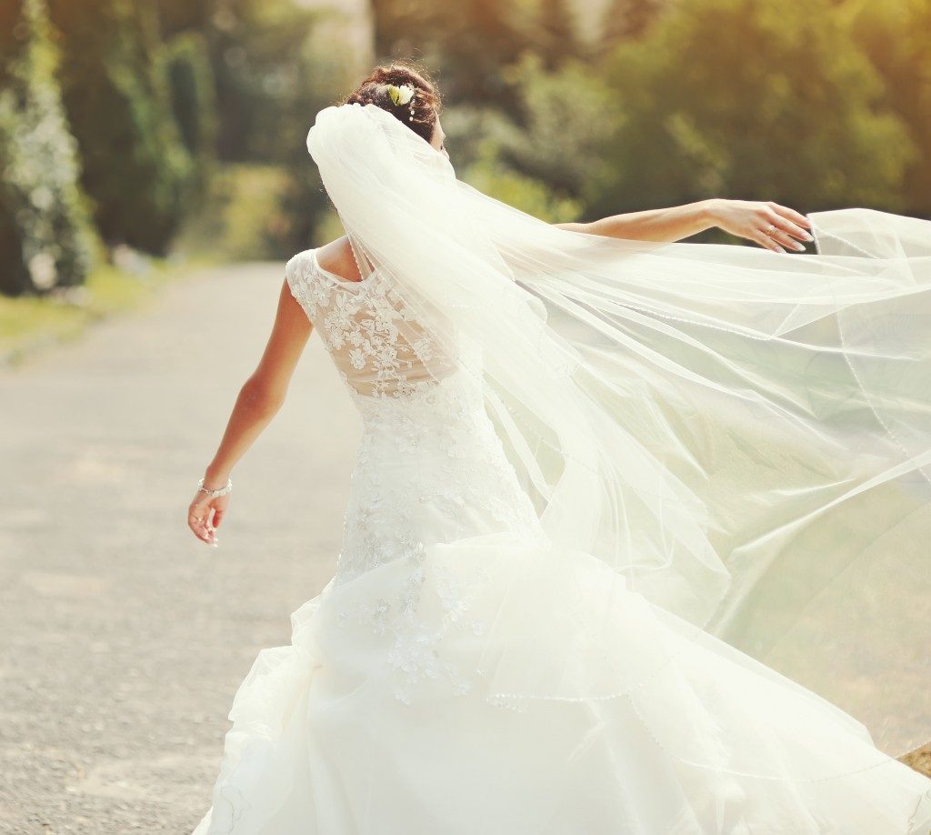 woman spinning in her wedding dress