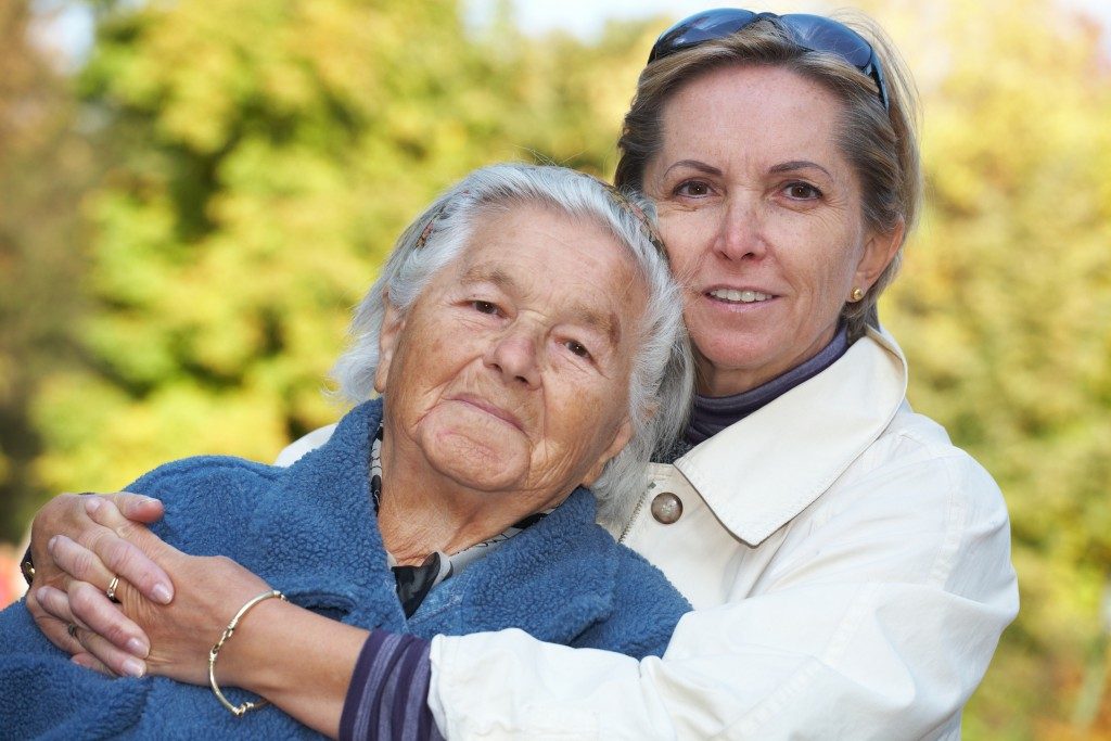 senior parents and daughter