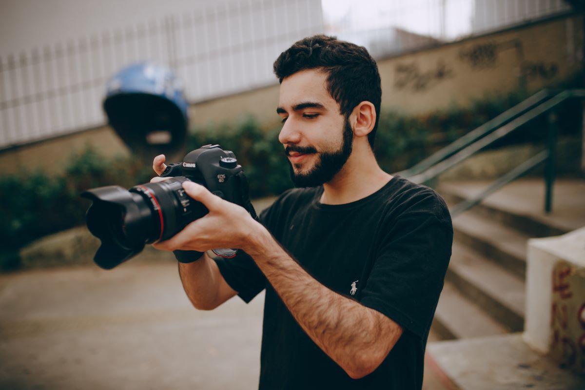 photographer looking at his camera