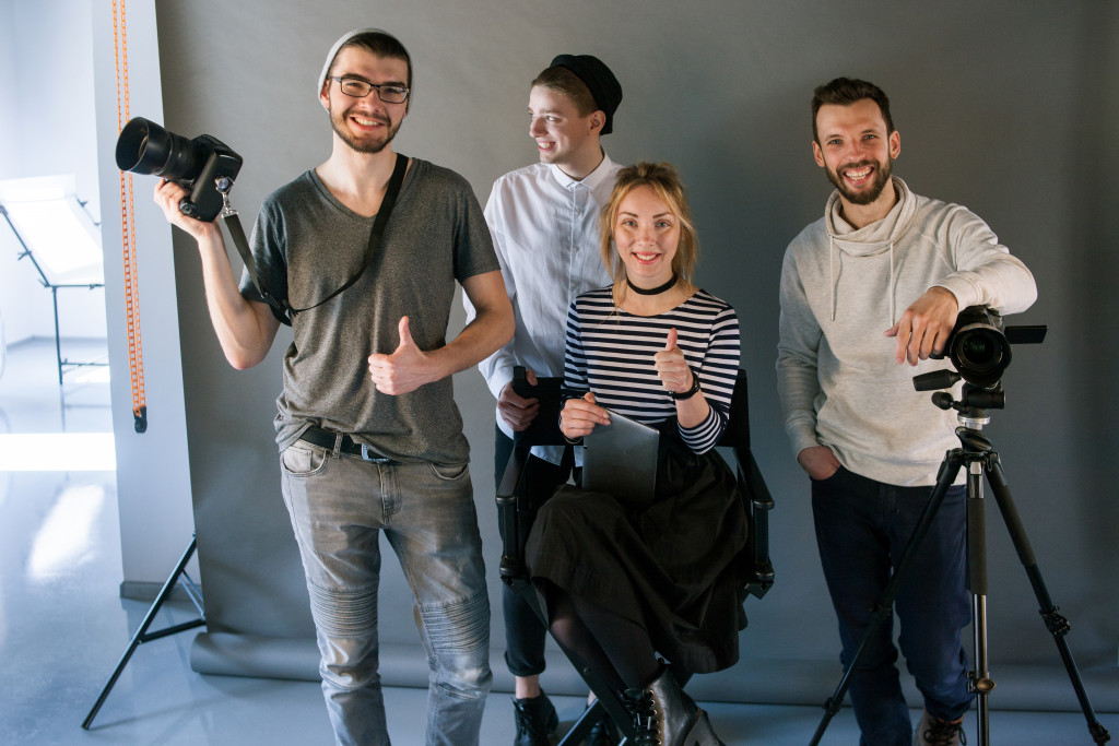 photographers smile in front of the camera