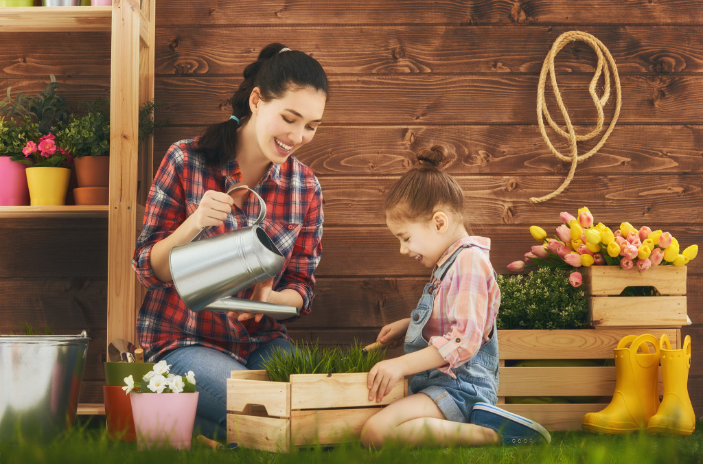 mom and daughter gardening together