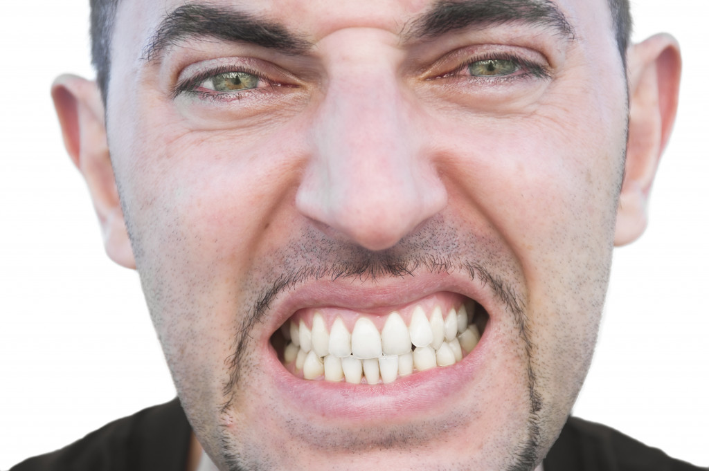 man showing his teeth