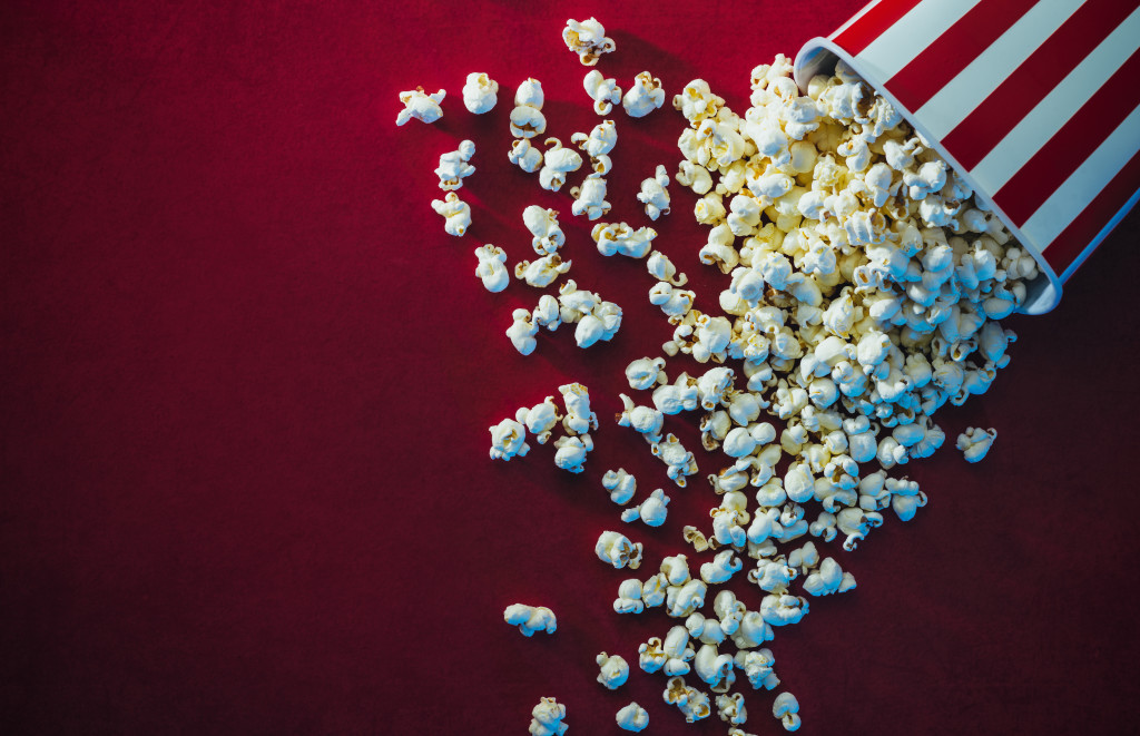 spilled popcorn on background cinema red carpet