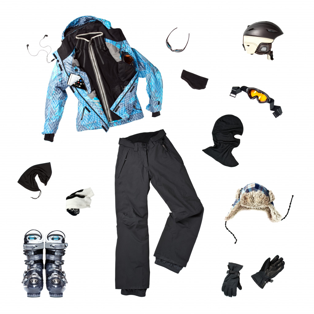 Cold weather clothing with a jacket, pants, gloves, and other items to keep a person warm.