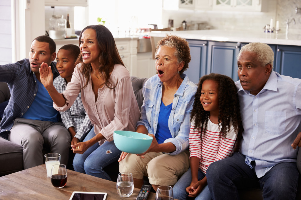 a happy family watching together