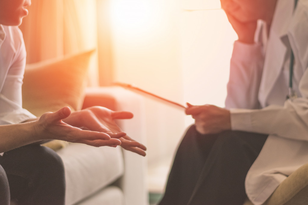 therapist talking to patient