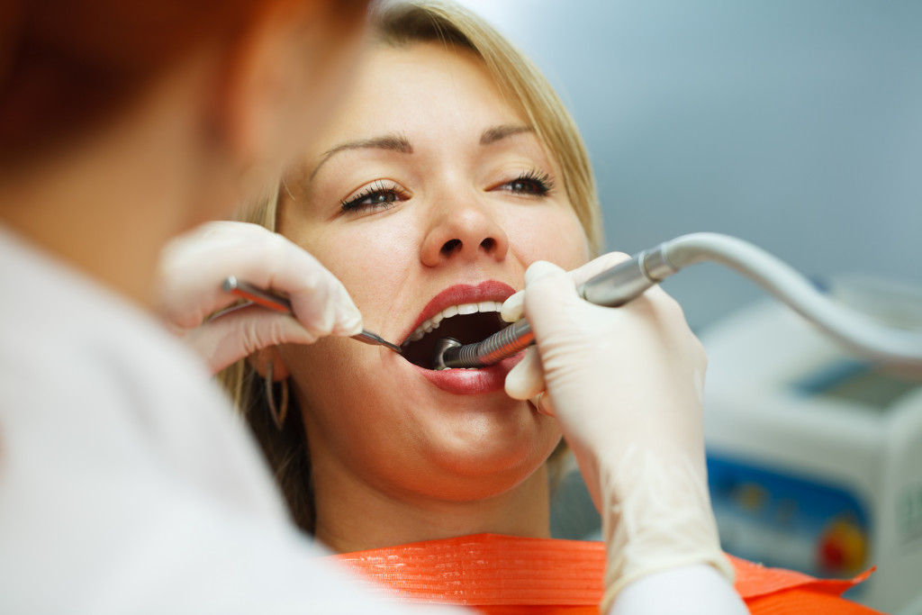 A woman having her teeth cleaned