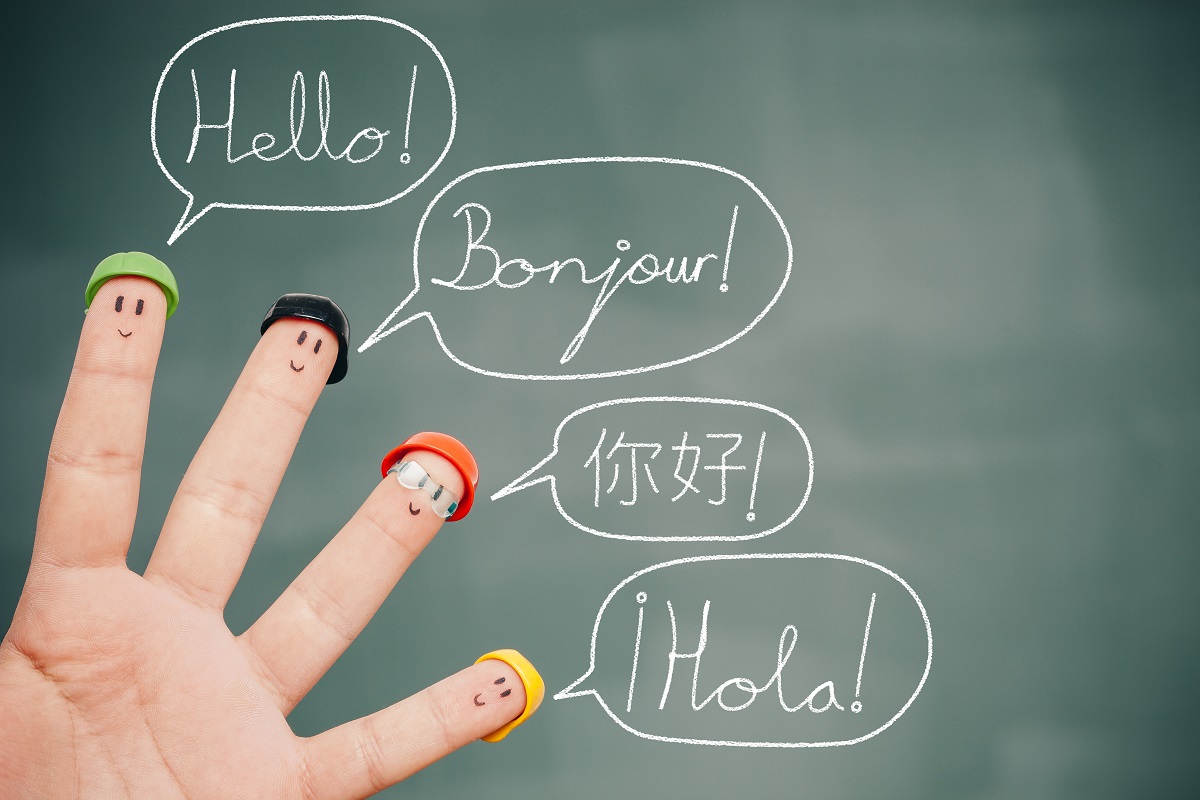 four smiley fingers saying hello in different languages