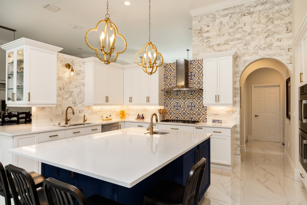 luxury kitchen with countertop and chandeliers