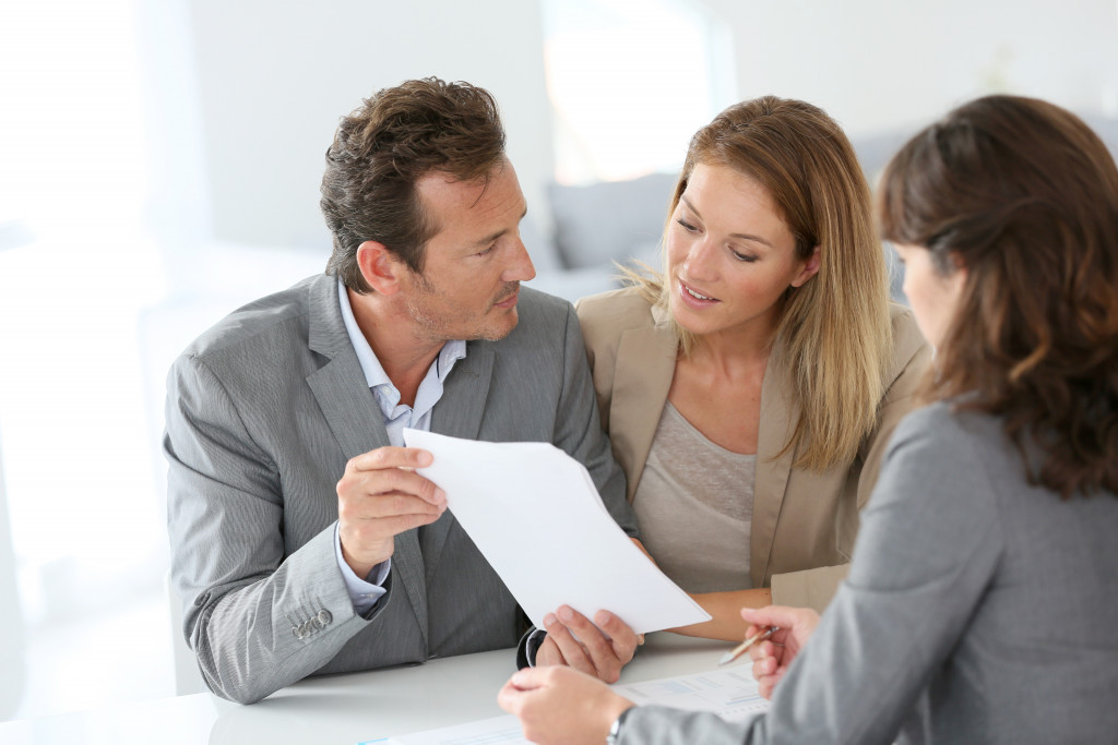 a couple consulting a professional for their house