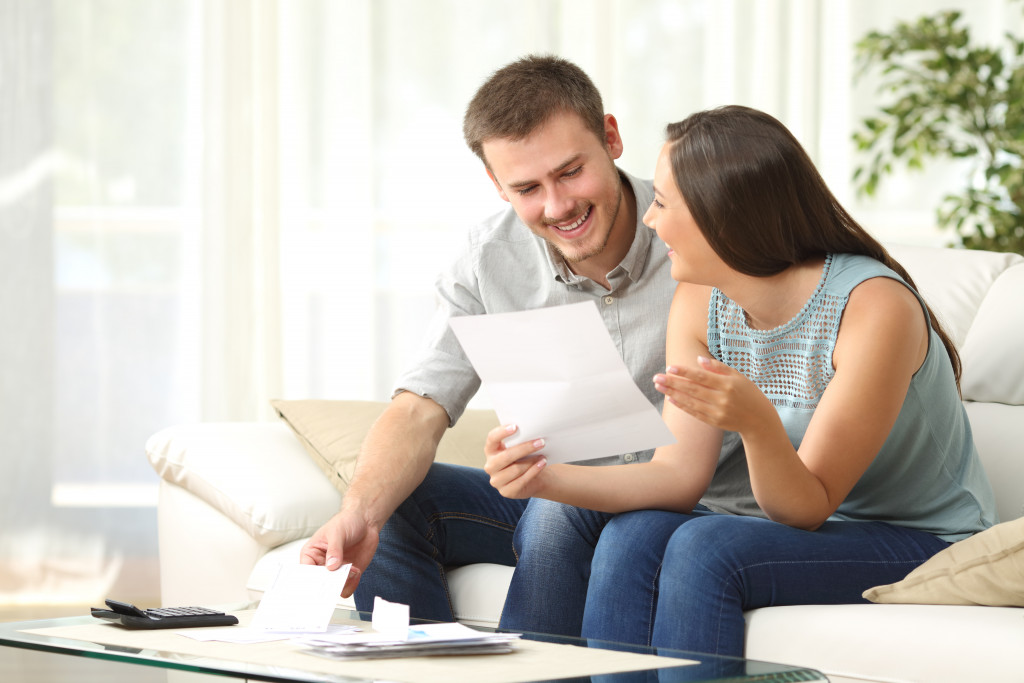 couple at home checking their insurance